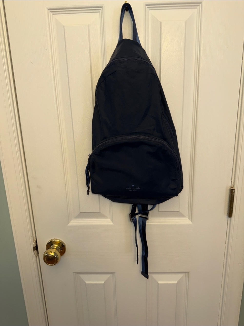 kate spade Black Nylon Sling Backpack with Navy Strap Accent